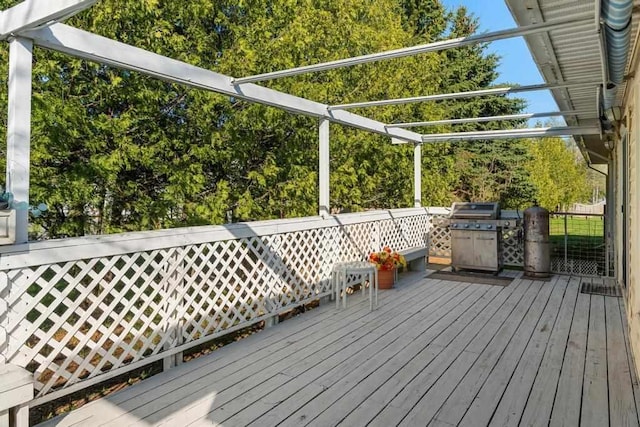 6141 S Old 31, Charlevoix, MI 49720 - wooden deck featuring a grill