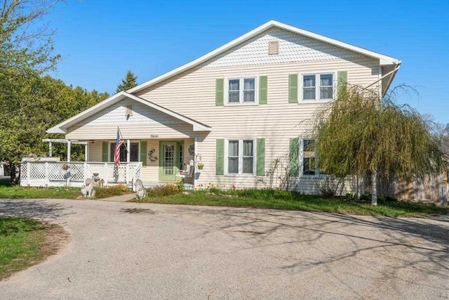 6141 S Old 31, Charlevoix, MI 49720 - victorian-style house with a porch