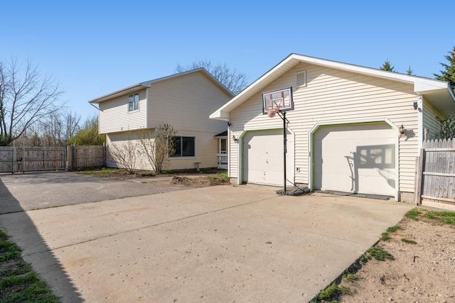6141 S Old 31, Charlevoix, MI 49720 - view of side of home with driveway, a garage, and fence