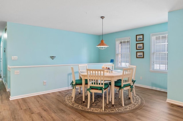 12175 Cottage Ln Unit 2, Charlevoix, MI 49720 - dining area featuring wood finished floors and baseboards