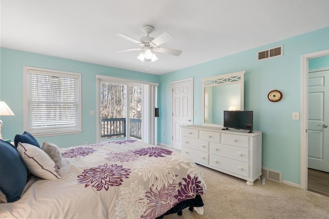 12175 Cottage Ln Unit 2, Charlevoix, MI 49720 - bedroom featuring access to outside, baseboards, a ceiling fan, and light colored carpet