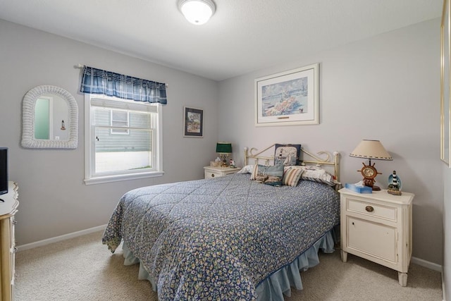 12175 Cottage Ln Unit 2, Charlevoix, MI 49720 - bedroom featuring light colored carpet and baseboards
