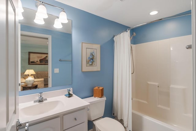 12175 Cottage Ln Unit 2, Charlevoix, MI 49720 - full bathroom with toilet, vanity, and shower / tub combo with curtain