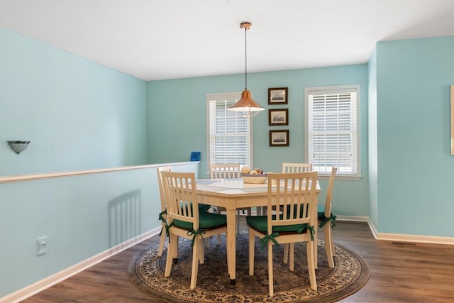 12175 Cottage Ln Unit 2, Charlevoix, MI 49720 - dining space featuring wood finished floors and baseboards