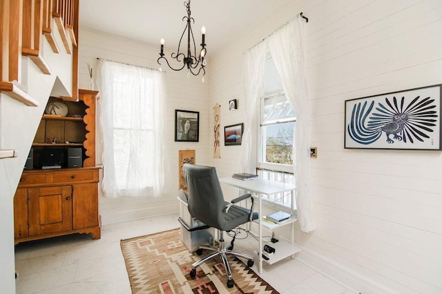 312 Grove St, Petoskey, MI 49770 - office space with light marble finish floors, a chandelier, and healthy amount of natural light