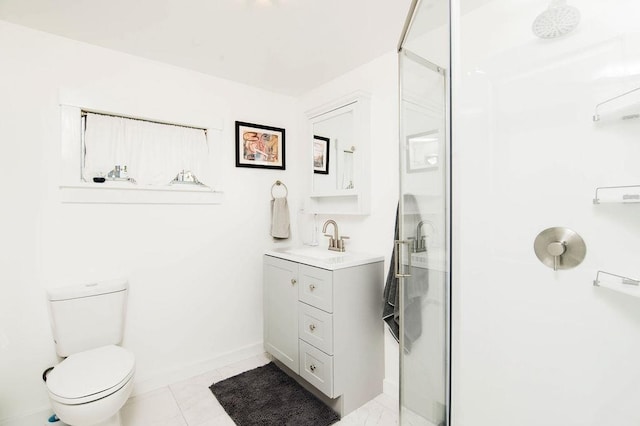 312 Grove St, Petoskey, MI 49770 - bathroom featuring a stall shower, vanity, toilet, baseboards, and tile patterned flooring