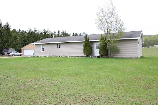 4155 Welsch Rd, Petoskey, MI 49770 - view of front of property with a front lawn and a detached garage