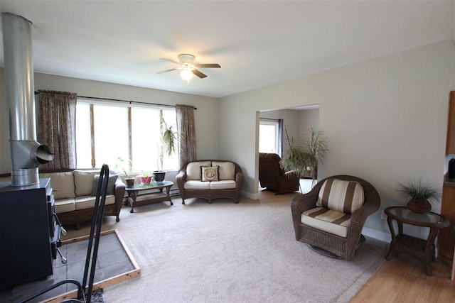 4155 Welsch Rd, Petoskey, MI 49770 - living area with a ceiling fan and baseboards