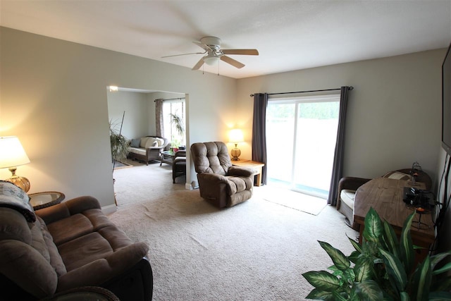 4155 Welsch Rd, Petoskey, MI 49770 - carpeted living area featuring a ceiling fan and healthy amount of natural light