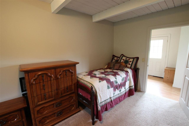 4155 Welsch Rd, Petoskey, MI 49770 - carpeted bedroom featuring beam ceiling and wood ceiling
