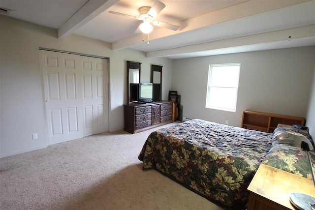 4155 Welsch Rd, Petoskey, MI 49770 - bedroom with beamed ceiling, carpet flooring, baseboards, ceiling fan, and a closet