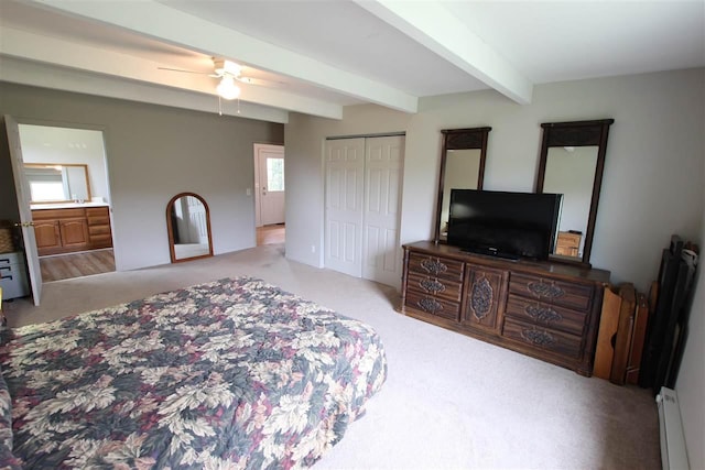 4155 Welsch Rd, Petoskey, MI 49770 - bedroom featuring a baseboard heating unit, carpet floors, beam ceiling, a closet, and ceiling fan