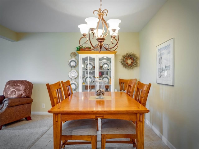 911 Regent Ct, Petoskey, MI 49770 - dining area with a chandelier and baseboards