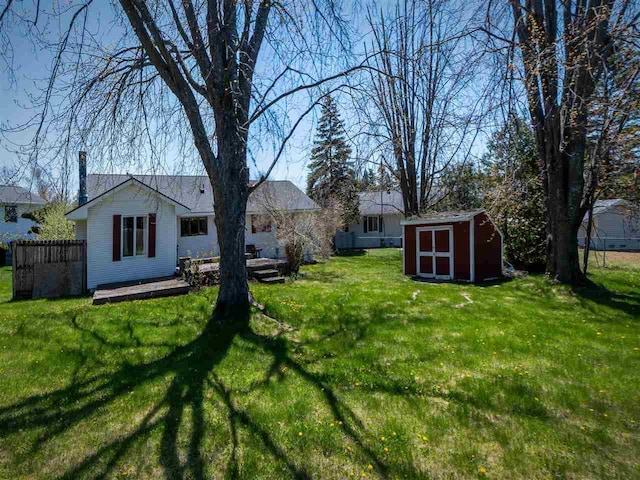 911 Regent Ct, Petoskey, MI 49770 - view of yard featuring a storage shed and an outbuilding