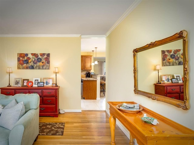 911 Regent Ct, Petoskey, MI 49770 - living room with ornamental molding, light wood finished floors, and baseboards