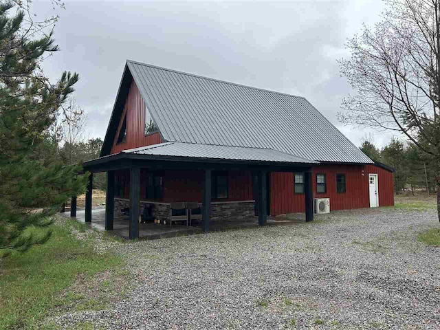 1645 Riley Rd, Kalkaska, MI 49646 - view of front of property with metal roof