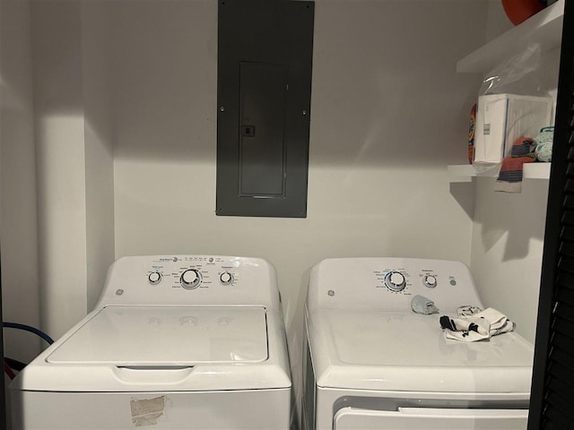 1645 Riley Rd, Kalkaska, MI 49646 - laundry area featuring electric panel and washing machine and dryer