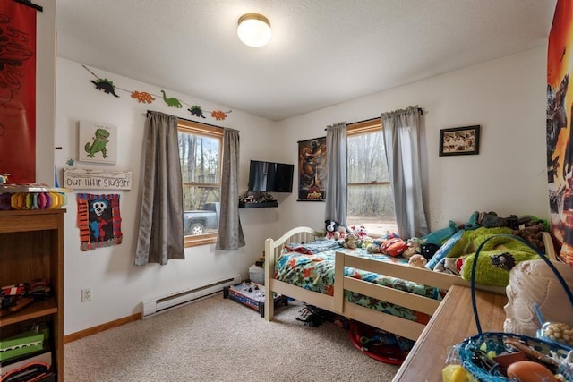 8900 Lewis Rd, Vanderbilt, MI 49795 - carpeted bedroom featuring a baseboard heating unit and baseboards