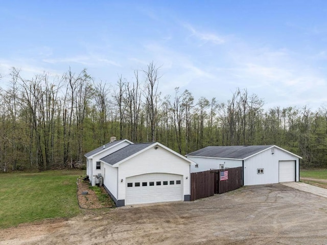 8900 Lewis Rd, Vanderbilt, MI 49795 - detached garage with a forest view