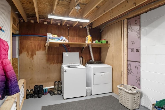 8900 Lewis Rd, Vanderbilt, MI 49795 - washroom featuring washer and clothes dryer and concrete block wall