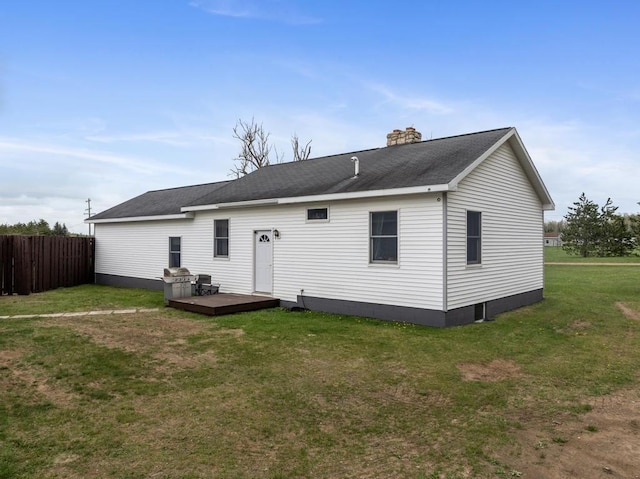 8900 Lewis Rd, Vanderbilt, MI 49795 - back of property featuring a deck and a chimney