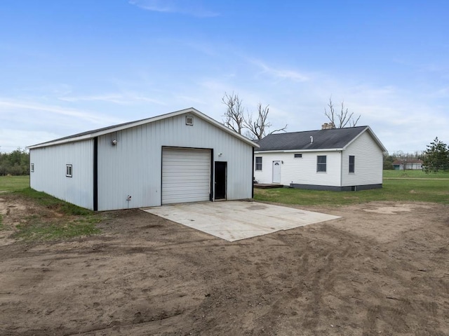 8900 Lewis Rd, Vanderbilt, MI 49795 - detached garage featuring dirt driveway