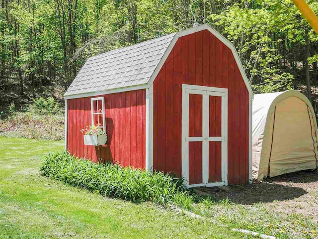 2729 Ranney Rd, East Jordan, MI 49727 - view of shed featuring a forest view
