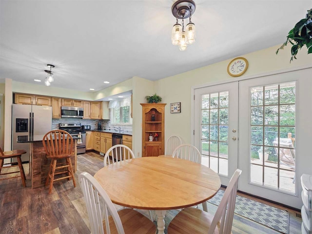 2729 Ranney Rd, East Jordan, MI 49727 - dining area with wood finished floors, recessed lighting, and french doors