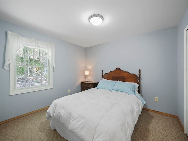 2729 Ranney Rd, East Jordan, MI 49727 - carpeted bedroom with baseboards