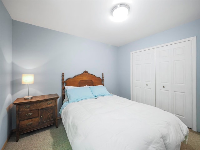 2729 Ranney Rd, East Jordan, MI 49727 - bedroom with carpet floors and a closet