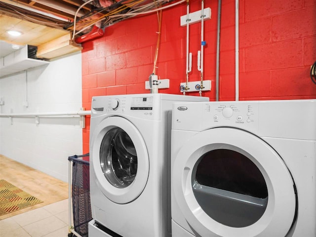 2729 Ranney Rd, East Jordan, MI 49727 - washroom with washing machine and clothes dryer and concrete block wall