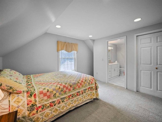 2729 Ranney Rd, East Jordan, MI 49727 - bedroom featuring recessed lighting, vaulted ceiling, carpet, and connected bathroom
