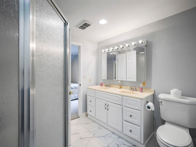 2729 Ranney Rd, East Jordan, MI 49727 - full bath with toilet, marble finish flooring, double vanity, and baseboards