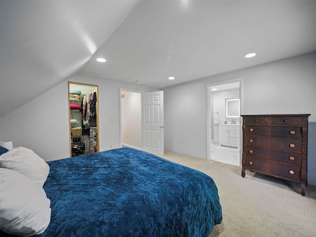 2729 Ranney Rd, East Jordan, MI 49727 - bedroom featuring recessed lighting, a walk in closet, carpet, a sink, and ensuite bathroom