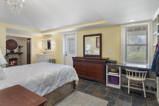 702 Michigan, Petoskey, MI 49770 - bedroom featuring a fireplace, lofted ceiling, and recessed lighting