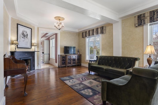 702 Michigan, Petoskey, MI 49770 - living area with hardwood / wood-style flooring, crown molding, a chandelier, a fireplace with flush hearth, and baseboards