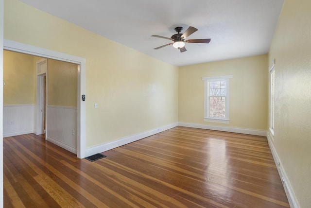 702 Michigan, Petoskey, MI 49770 - unfurnished room with wood finished floors, ceiling fan, and baseboards