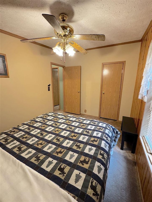 15500 Riverside Trl, Wolverine, MI 49799 - bedroom featuring ornamental molding, a textured ceiling, a ceiling fan, and light carpet