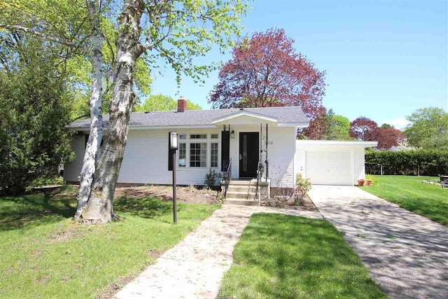 204 Burns St, Charlevoix, MI 49720 - view of front of property featuring an attached garage, driveway, a chimney, and a front lawn