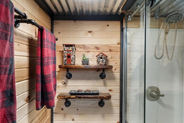3622 Big Sky Trl, Gaylord, MI 49735 - bathroom featuring a shower stall and wood walls