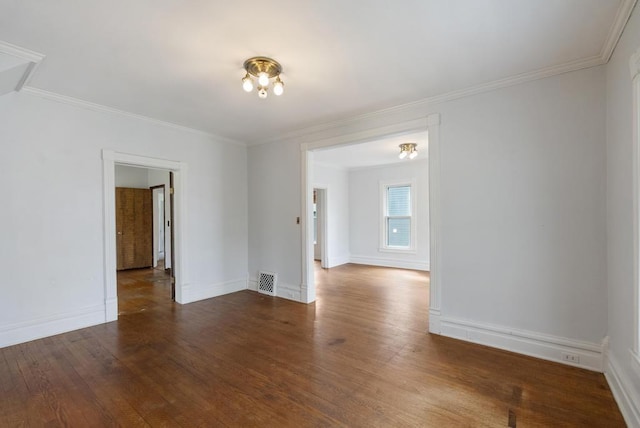 612 E Mitchell St, Petoskey, MI 49770 - unfurnished room with wood finished floors, ornamental molding, and baseboards