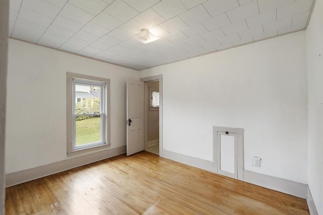 612 E Mitchell St, Petoskey, MI 49770 - spare room with light wood finished floors and baseboards