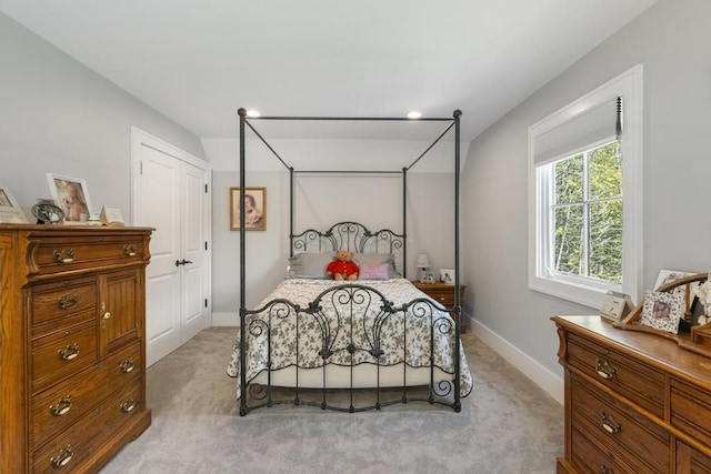 4435 Lake Shore Dr, Charlevoix, MI 49720 - bedroom featuring light colored carpet and baseboards
