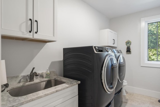 4435 Lake Shore Dr, Charlevoix, MI 49720 - laundry area featuring washer and dryer, baseboards, and cabinet space