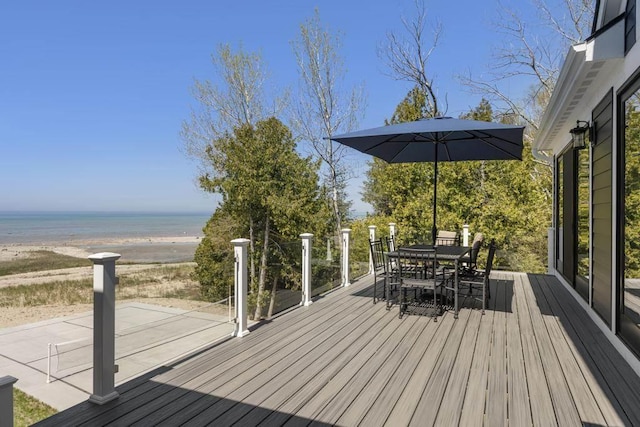 4435 Lake Shore Dr, Charlevoix, MI 49720 - deck featuring outdoor dining space and a water view