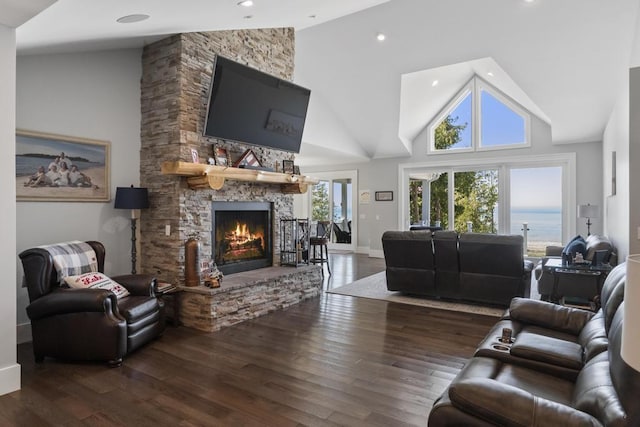 4435 Lake Shore Dr, Charlevoix, MI 49720 - living area featuring a fireplace, wood finished floors, high vaulted ceiling, recessed lighting, and baseboards