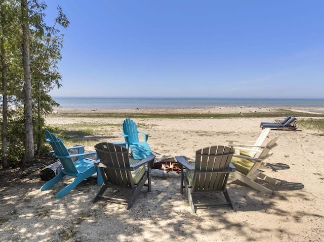4435 Lake Shore Dr, Charlevoix, MI 49720 - view of yard featuring an outdoor fire pit and view of water and beach
