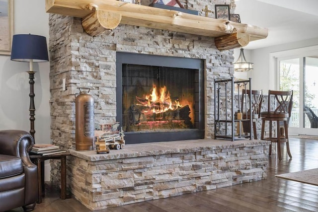 4435 Lake Shore Dr, Charlevoix, MI 49720 - detailed view of wood finished floors and a lit fireplace