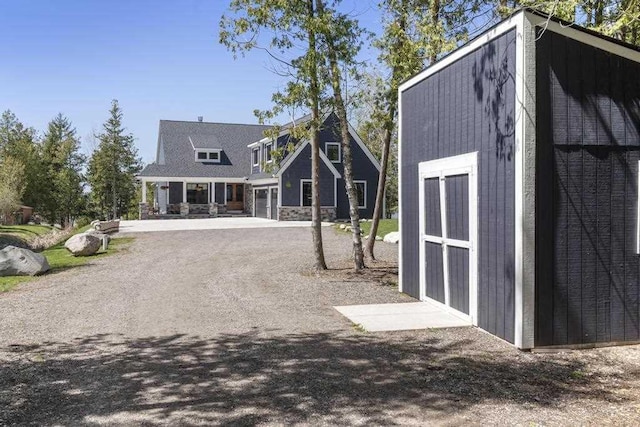 4435 Lake Shore Dr, Charlevoix, MI 49720 - rear view of house with driveway