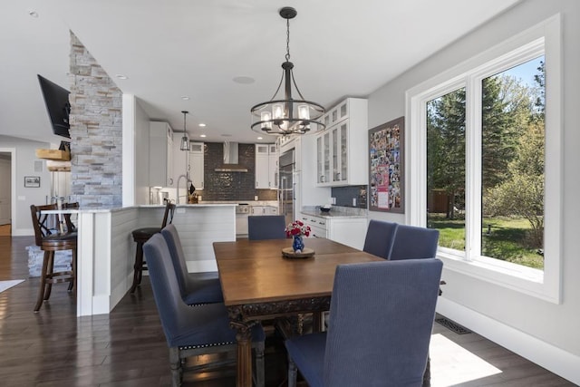 4435 Lake Shore Dr, Charlevoix, MI 49720 - dining room featuring plenty of natural light, a chandelier, dark wood-style flooring, and recessed lighting